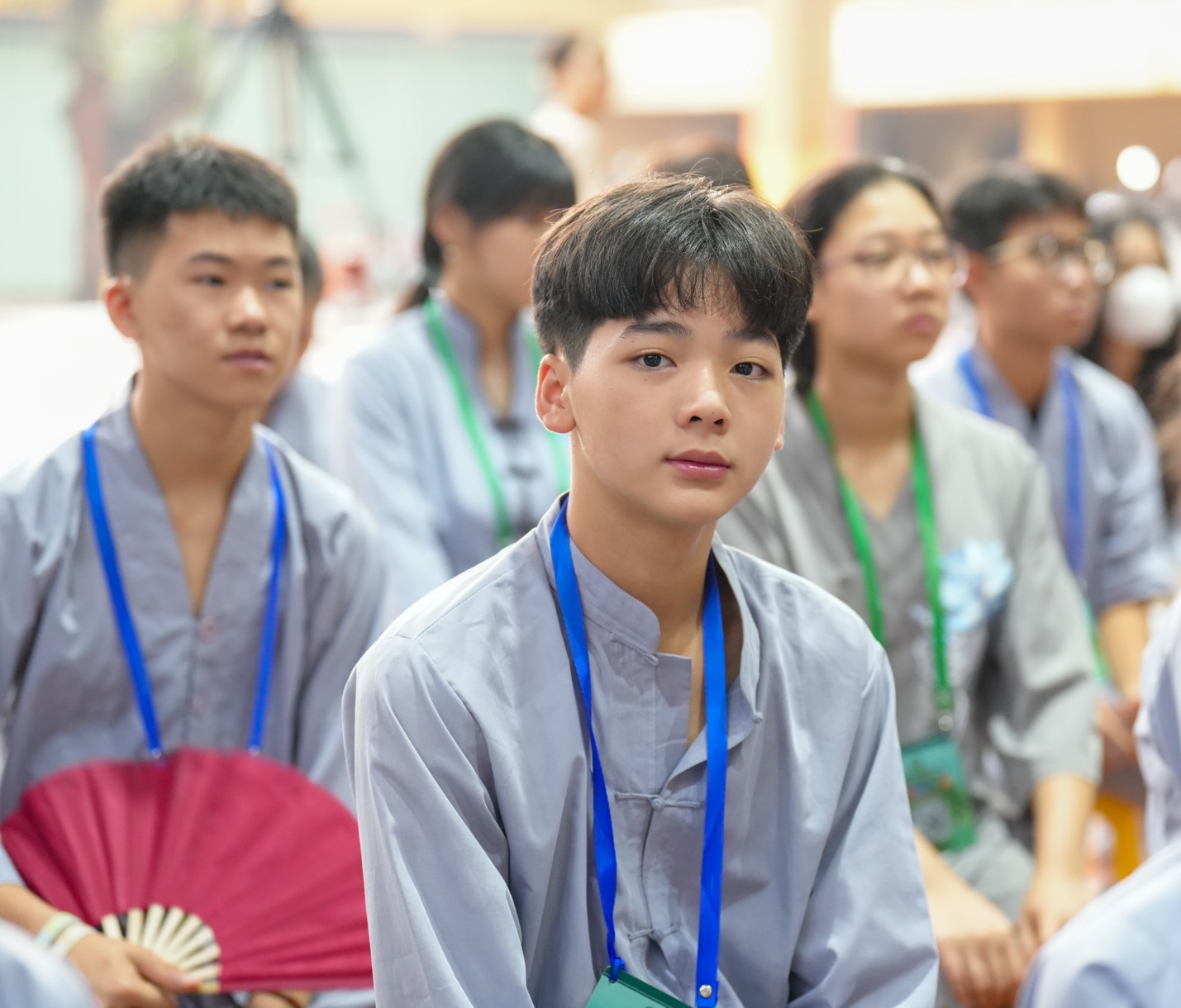 A group of people wearing lanyards AI-generated content may be incorrect.