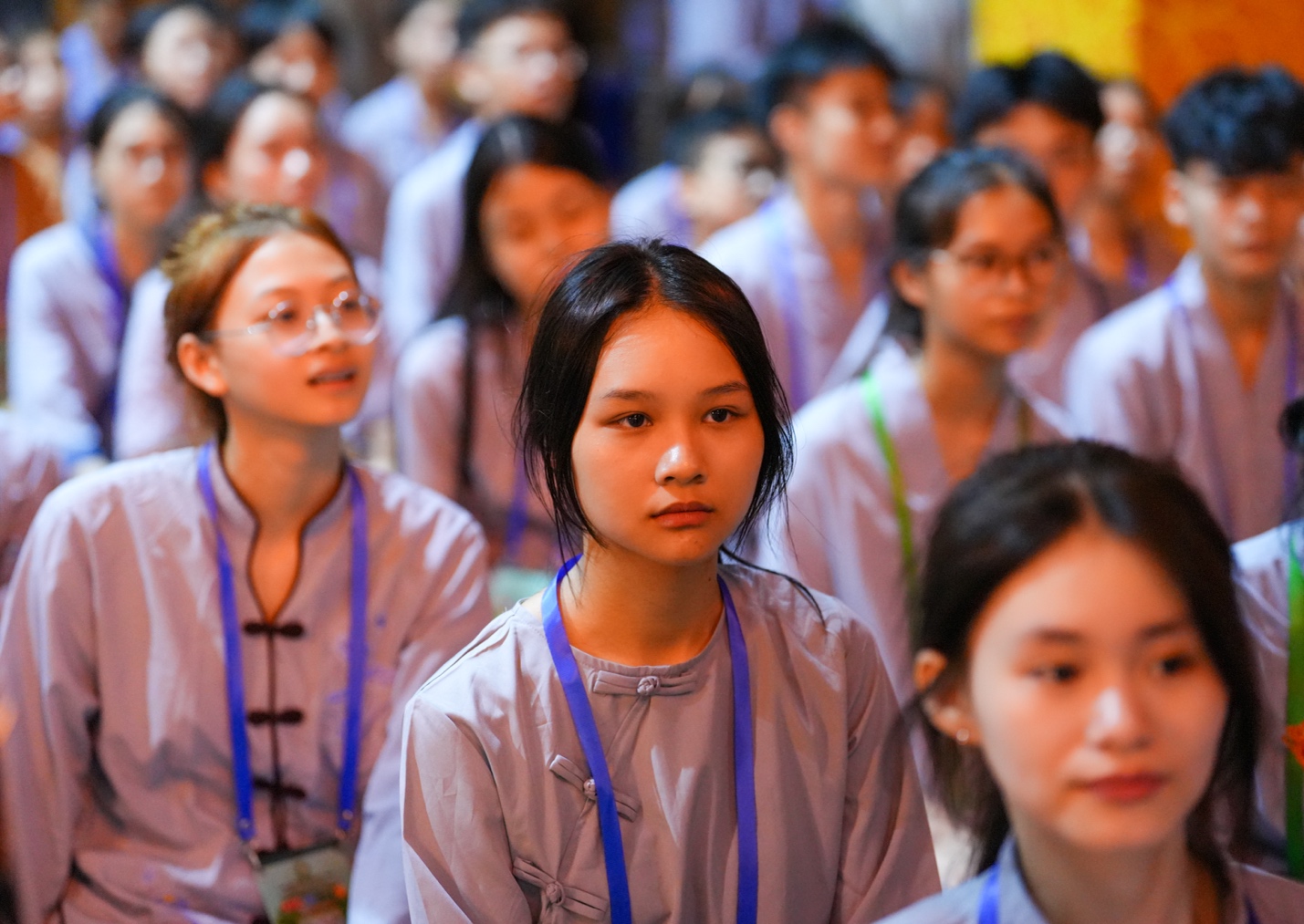 A group of people wearing matching lanyards AI-generated content may be incorrect.