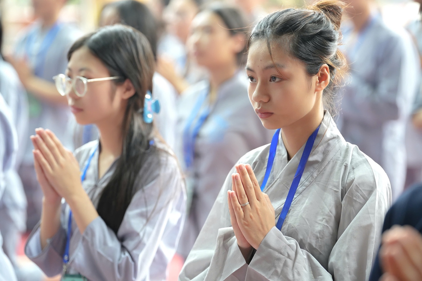 A group of women praying AI-generated content may be incorrect.