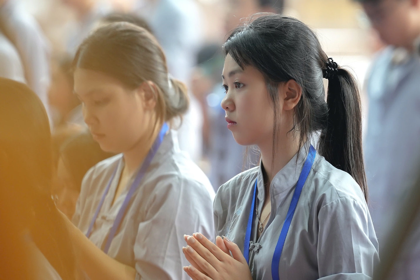 A group of women praying AI-generated content may be incorrect.