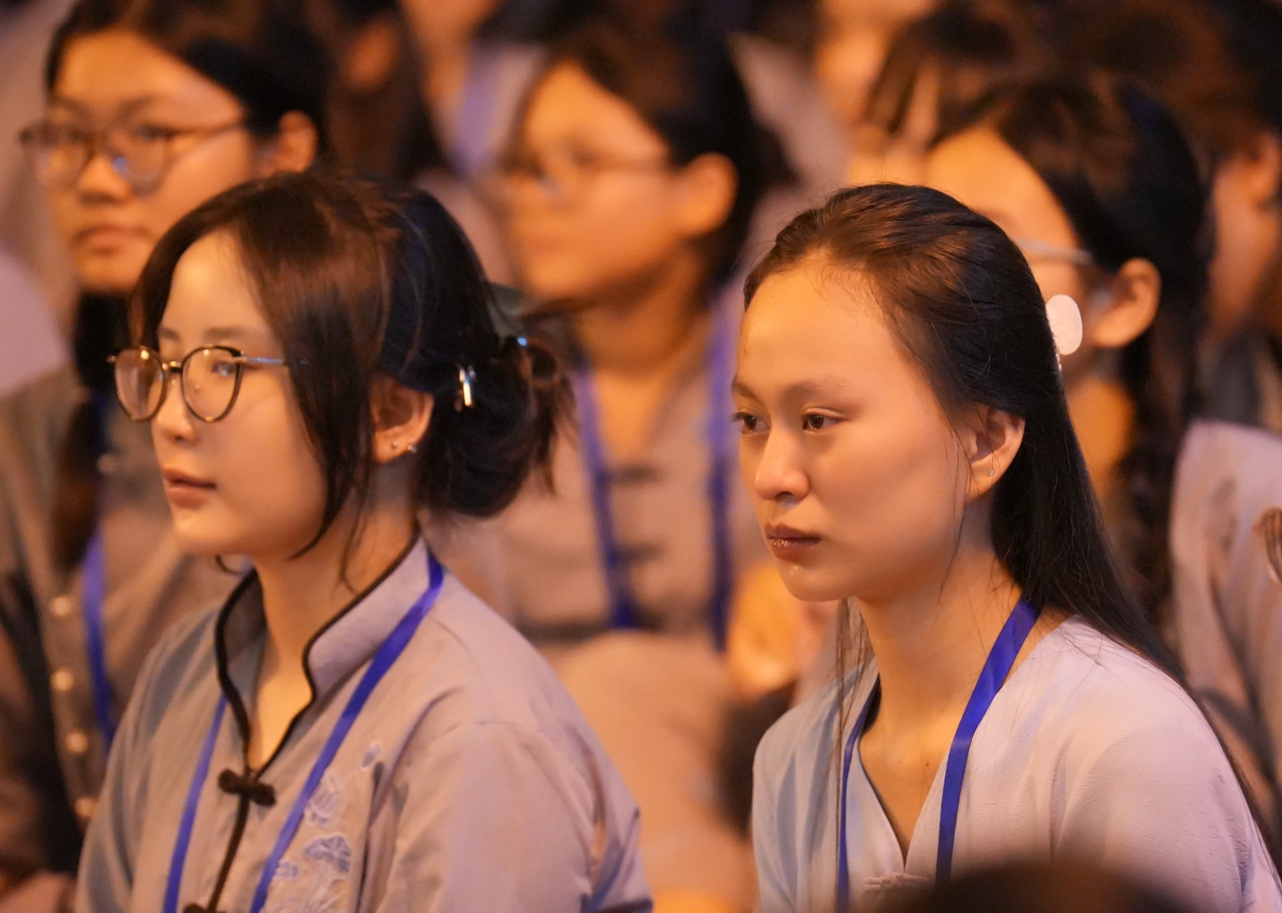 A group of women sitting in a room AI-generated content may be incorrect.