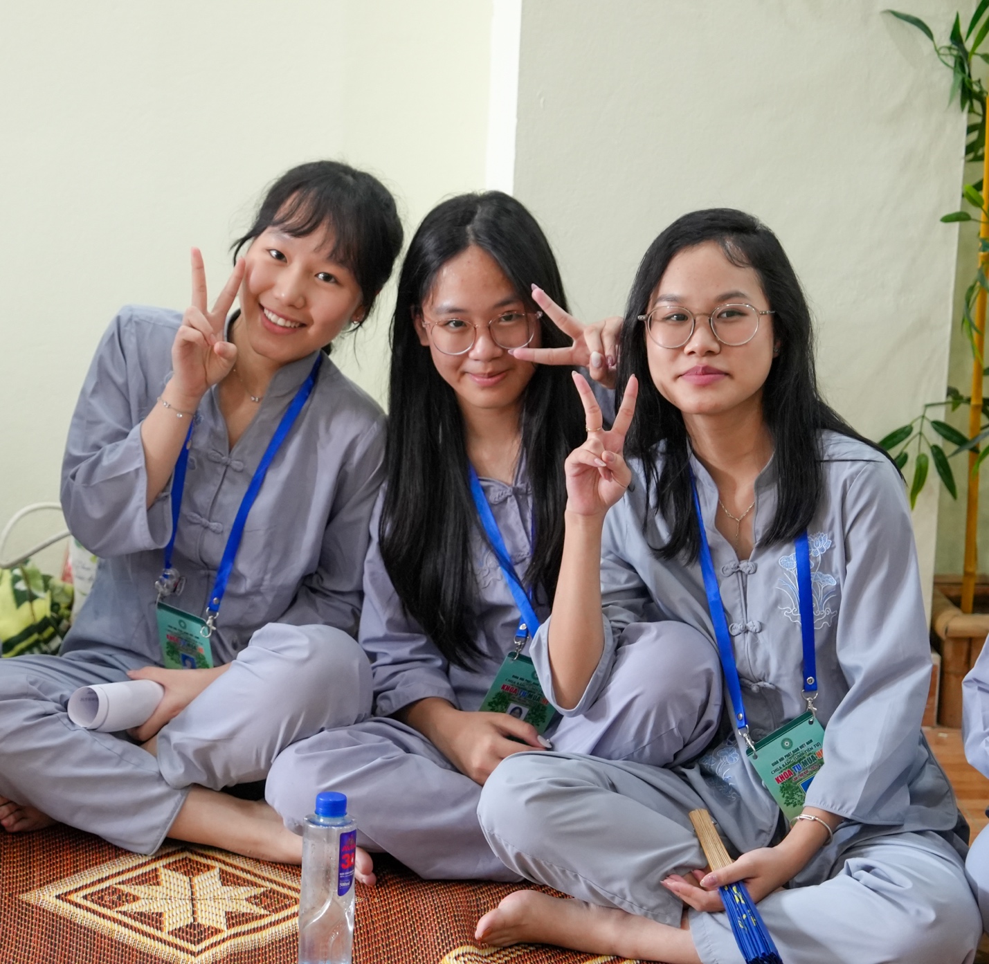 A group of women sitting on the floor

AI-generated content may be incorrect.