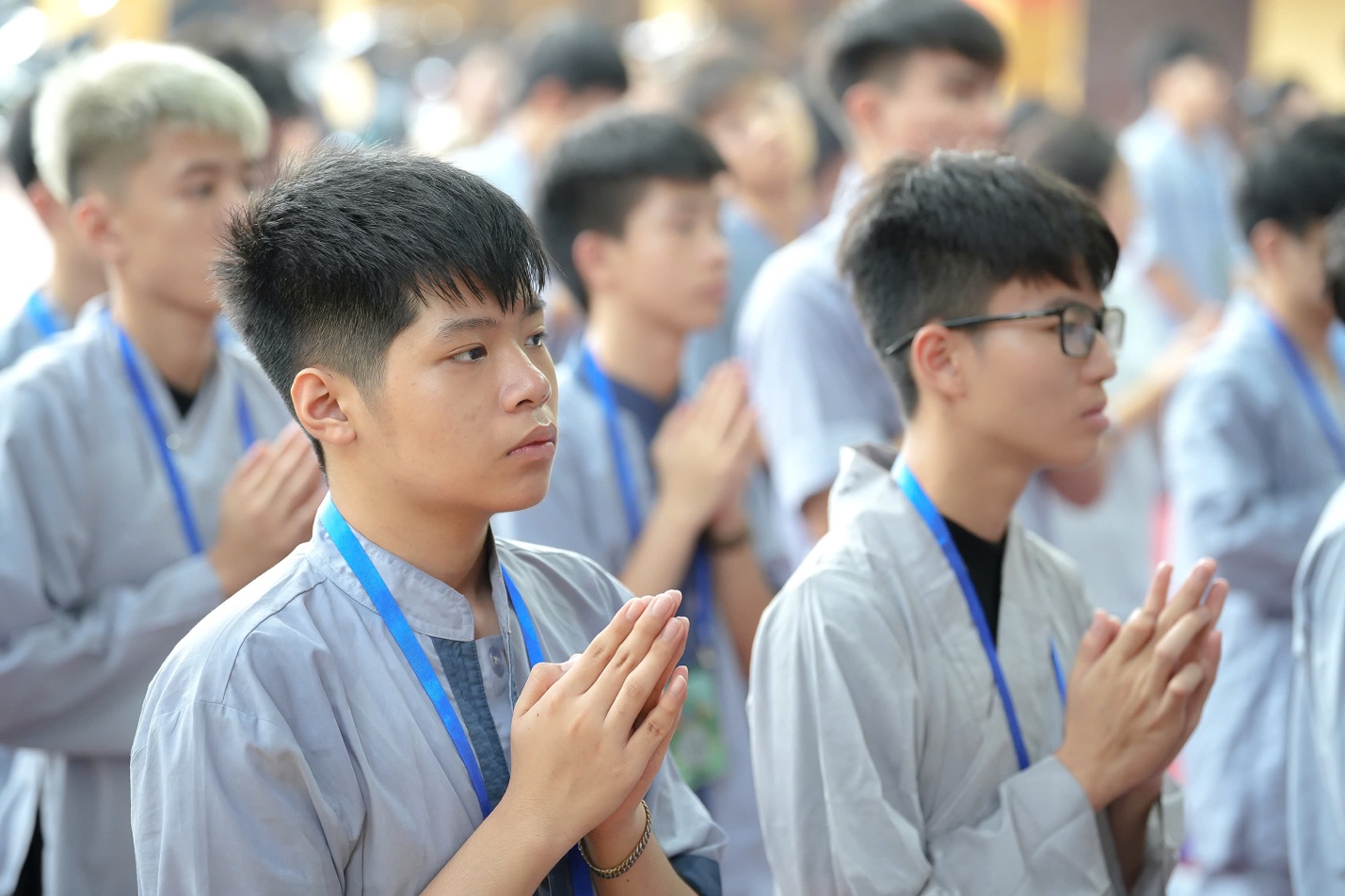 A group of young men praying AI-generated content may be incorrect.
