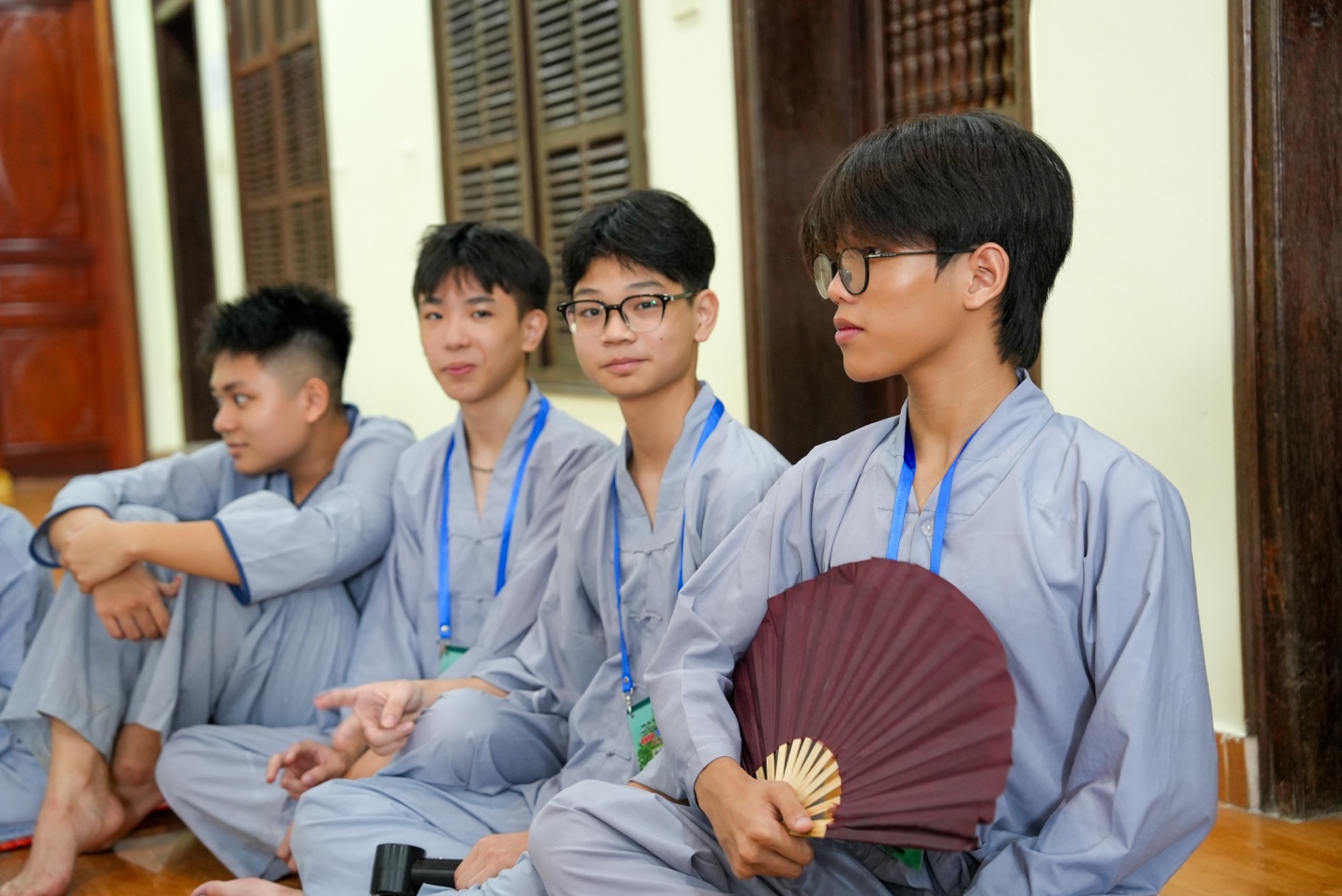 A group of young men wearing matching outfits

AI-generated content may be incorrect.