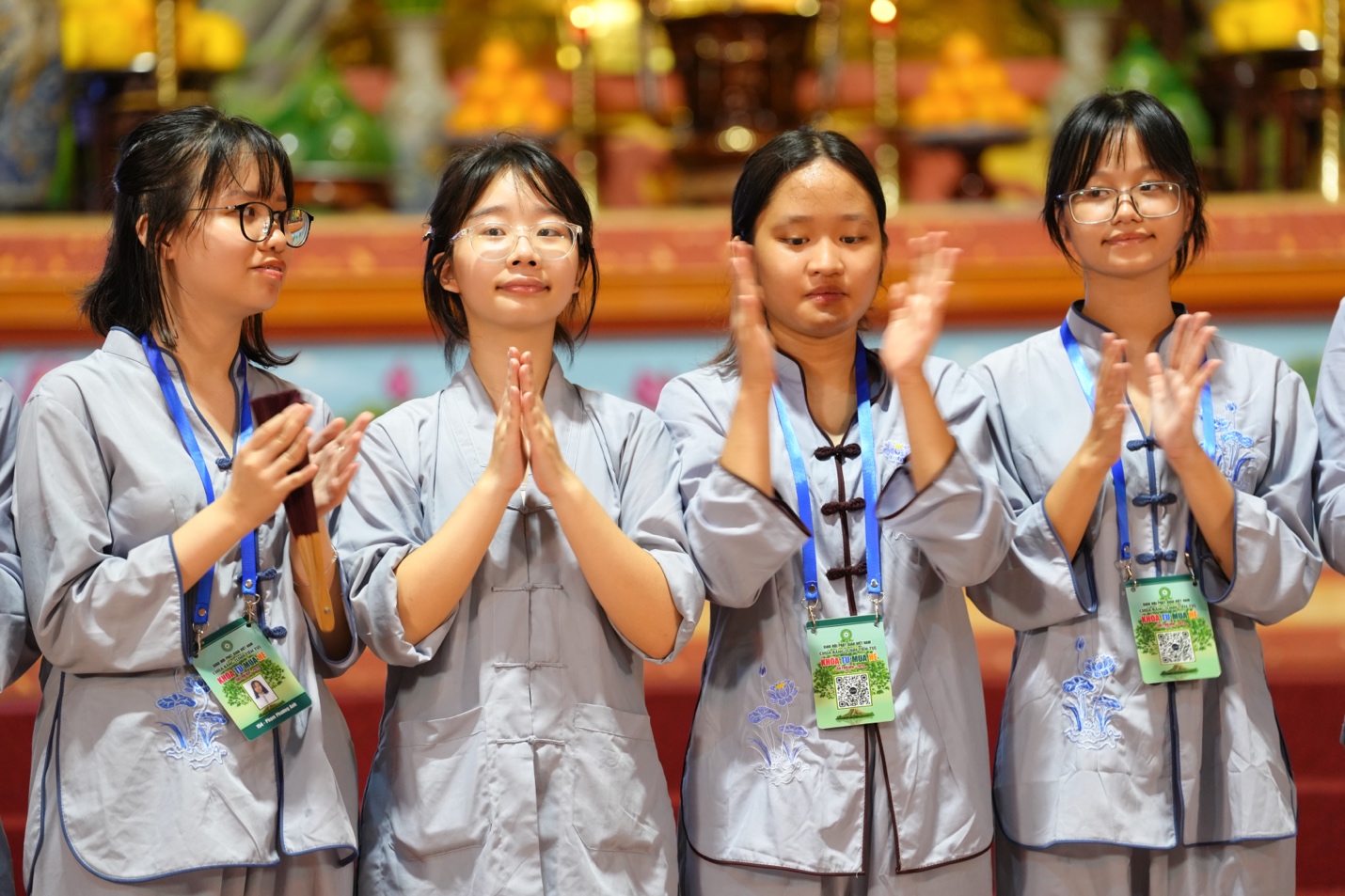 A group of young women clapping AI-generated content may be incorrect.