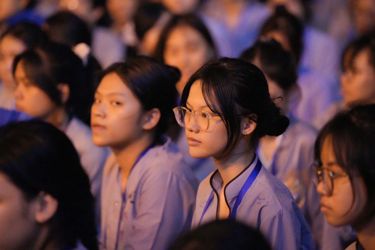 A group of young women in purple shirts AI-generated content may be incorrect.