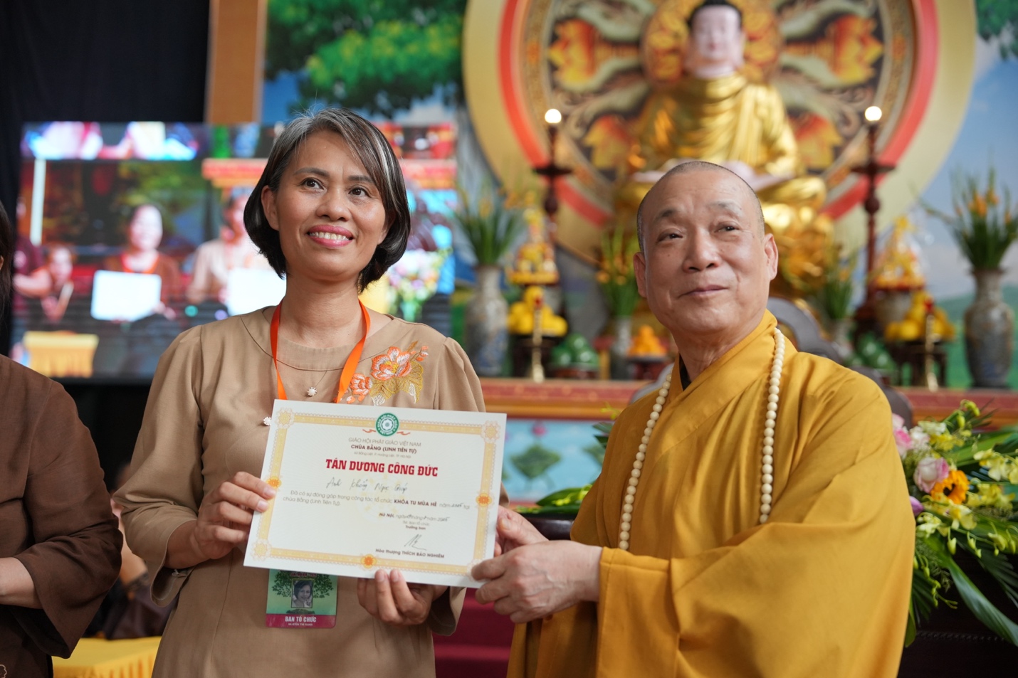 A person and person holding a certificate AI-generated content may be incorrect.