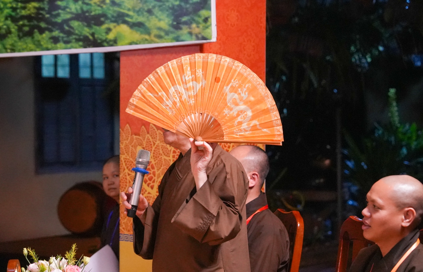 A person holding a fan AI-generated content may be incorrect.