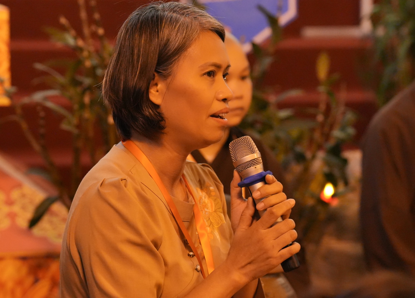 A person holding a microphone AI-generated content may be incorrect.
