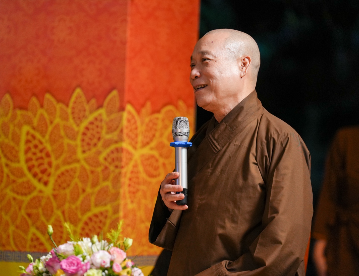 A person holding a microphone AI-generated content may be incorrect.