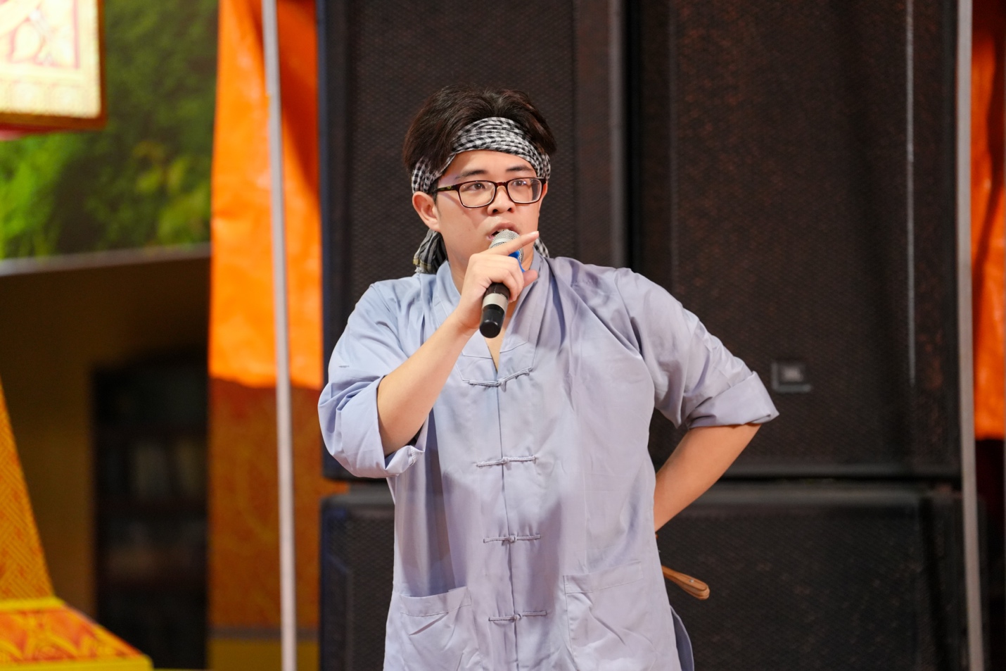 A person holding a microphone AI-generated content may be incorrect.