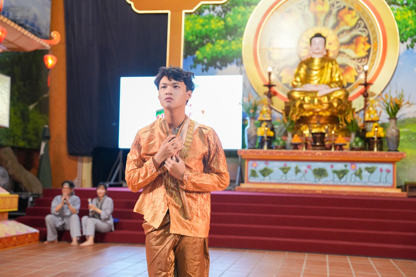A person in a gold suit AI-generated content may be incorrect.
