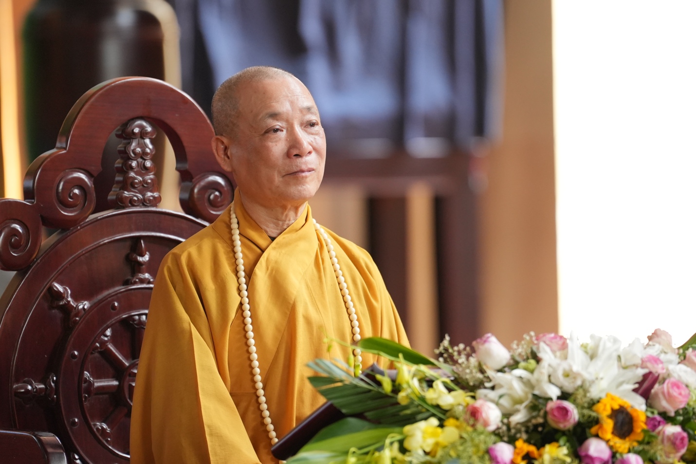 A person in a yellow robe AI-generated content may be incorrect.
