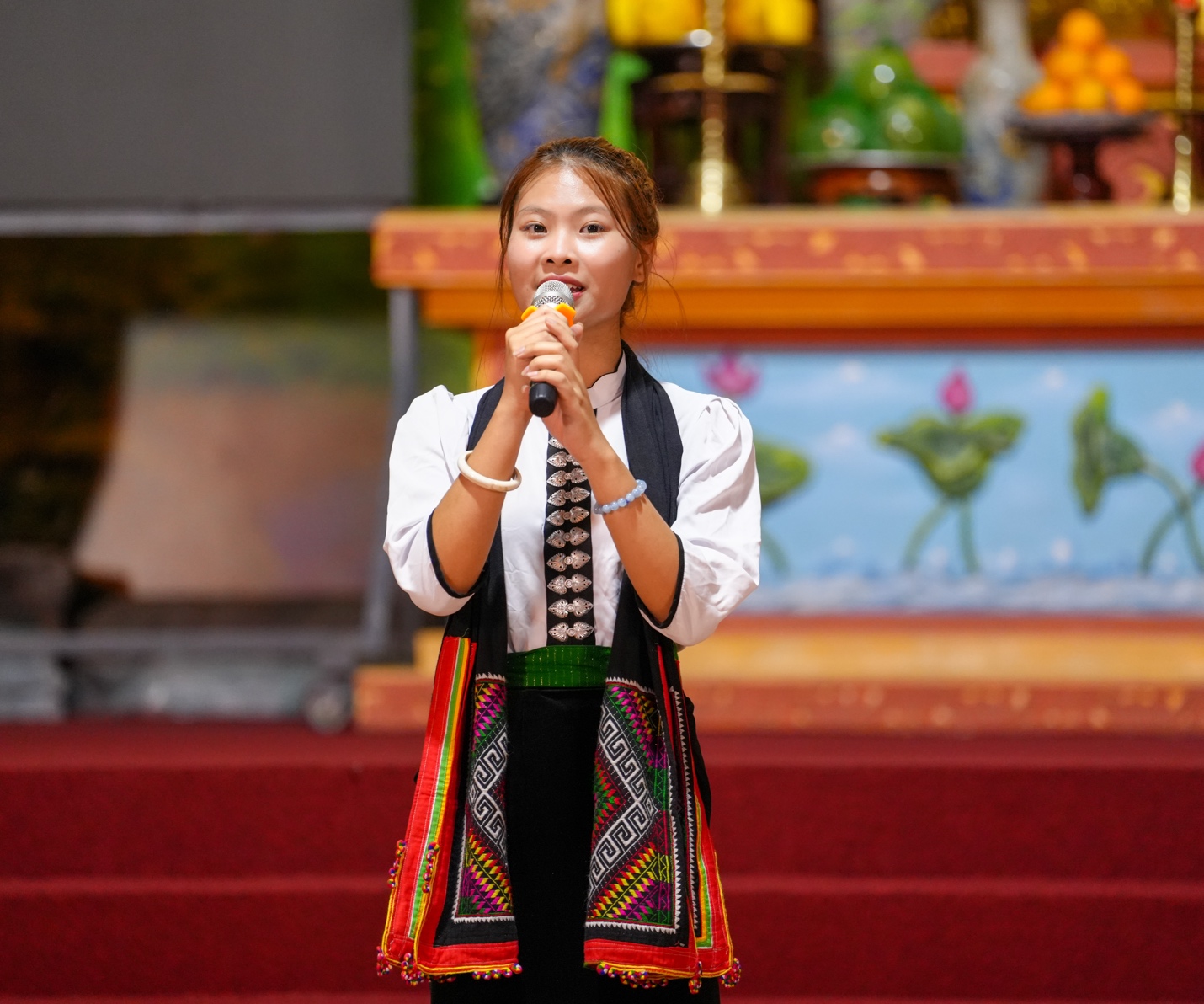 A person singing into a microphone AI-generated content may be incorrect.
