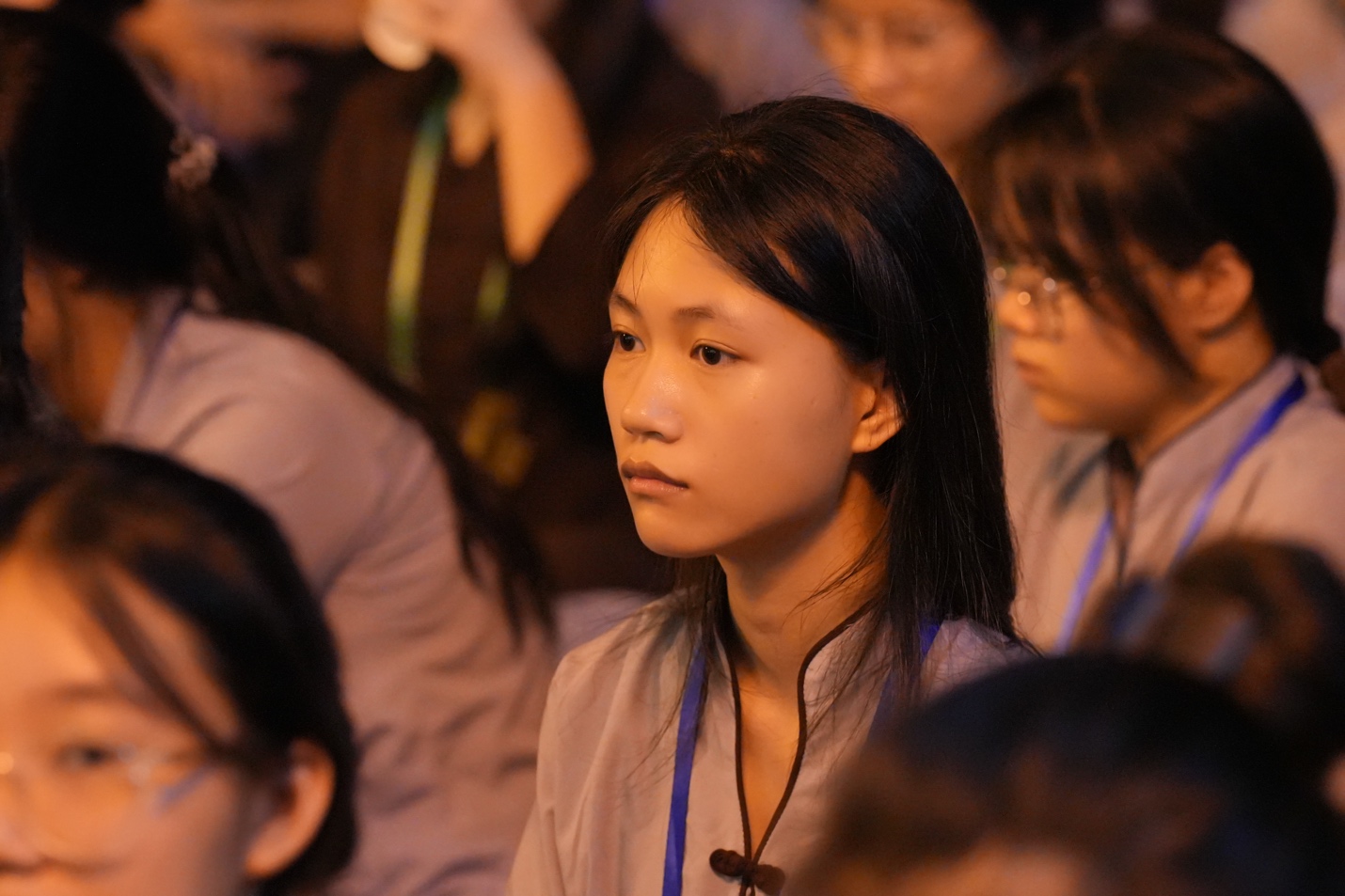 A person sitting in a room AI-generated content may be incorrect.