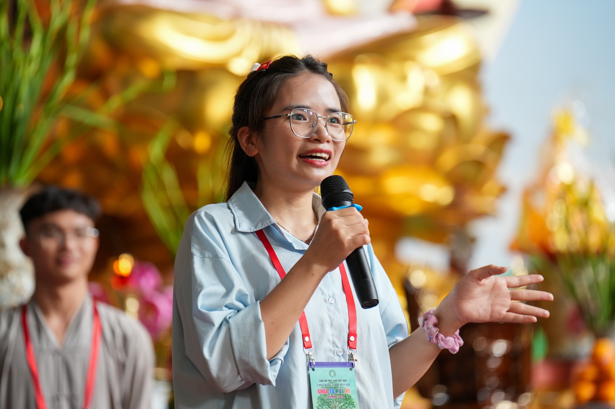 A person speaking into a microphone AI-generated content may be incorrect.