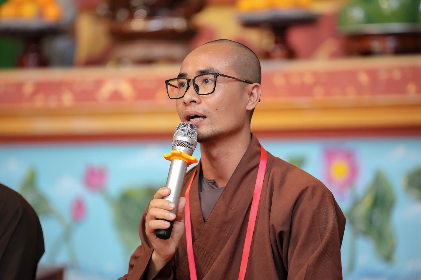 A person speaking into a microphone AI-generated content may be incorrect.