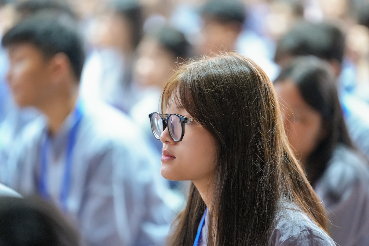 A person wearing glasses and looking away AI-generated content may be incorrect.
