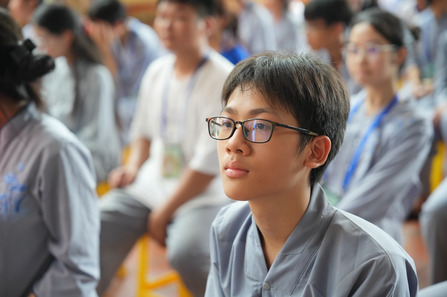 A young person wearing glasses AI-generated content may be incorrect.