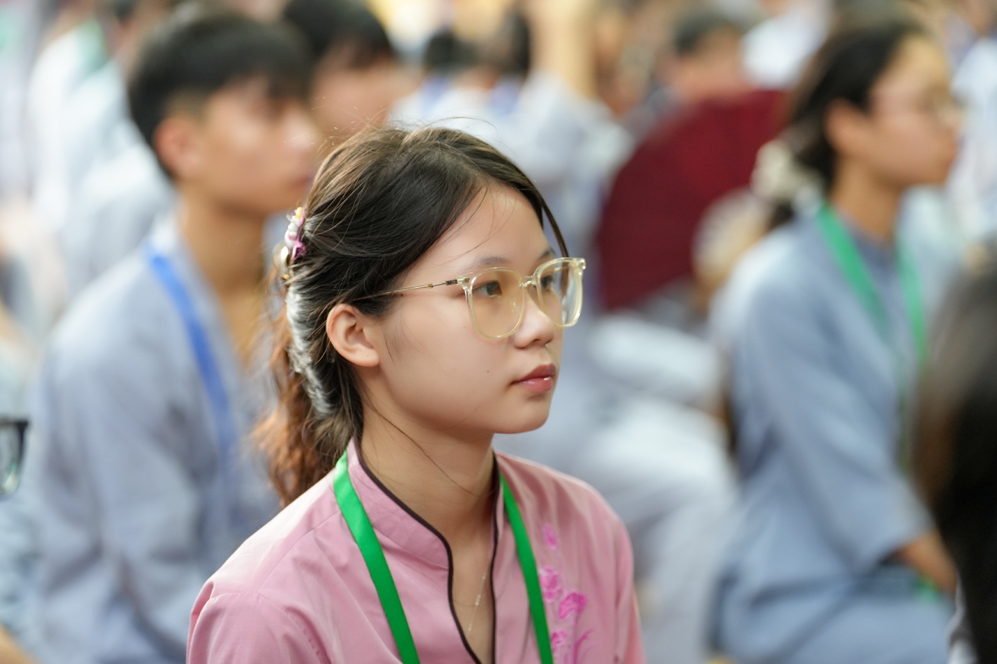 A young person wearing glasses AI-generated content may be incorrect.