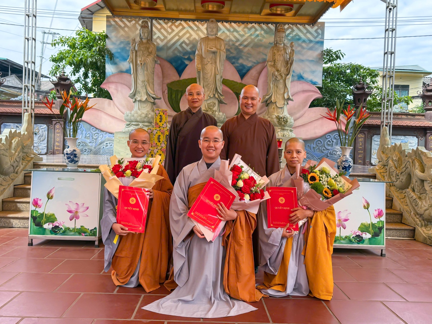 A group of people holding flowers and books AI-generated content may be incorrect.