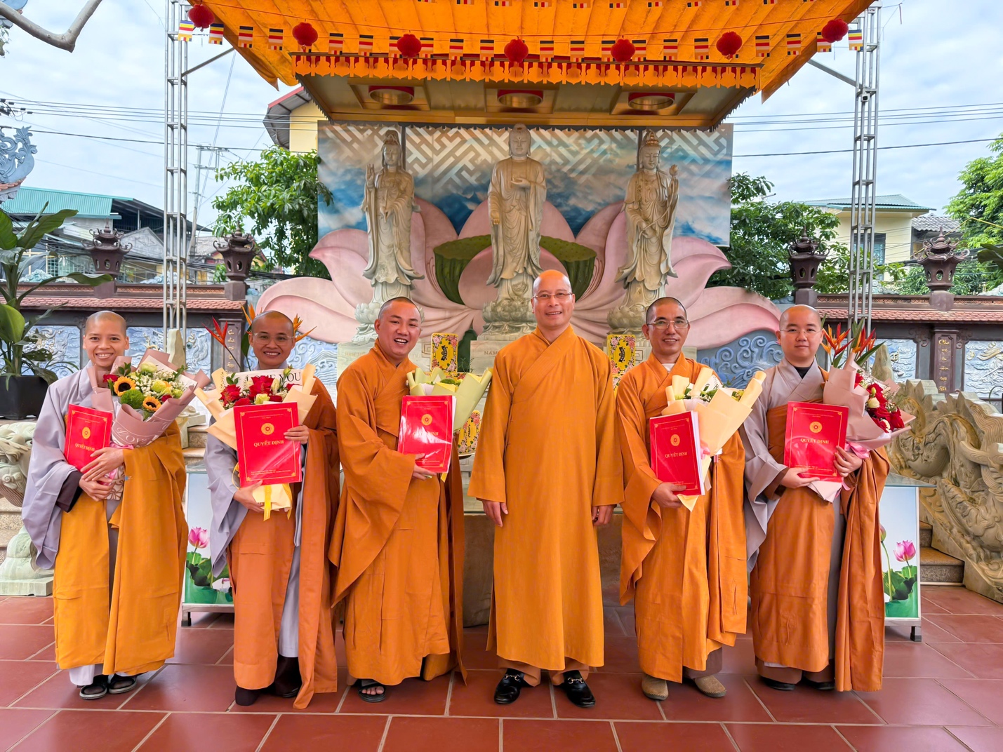 A group of people wearing orange robes AI-generated content may be incorrect.