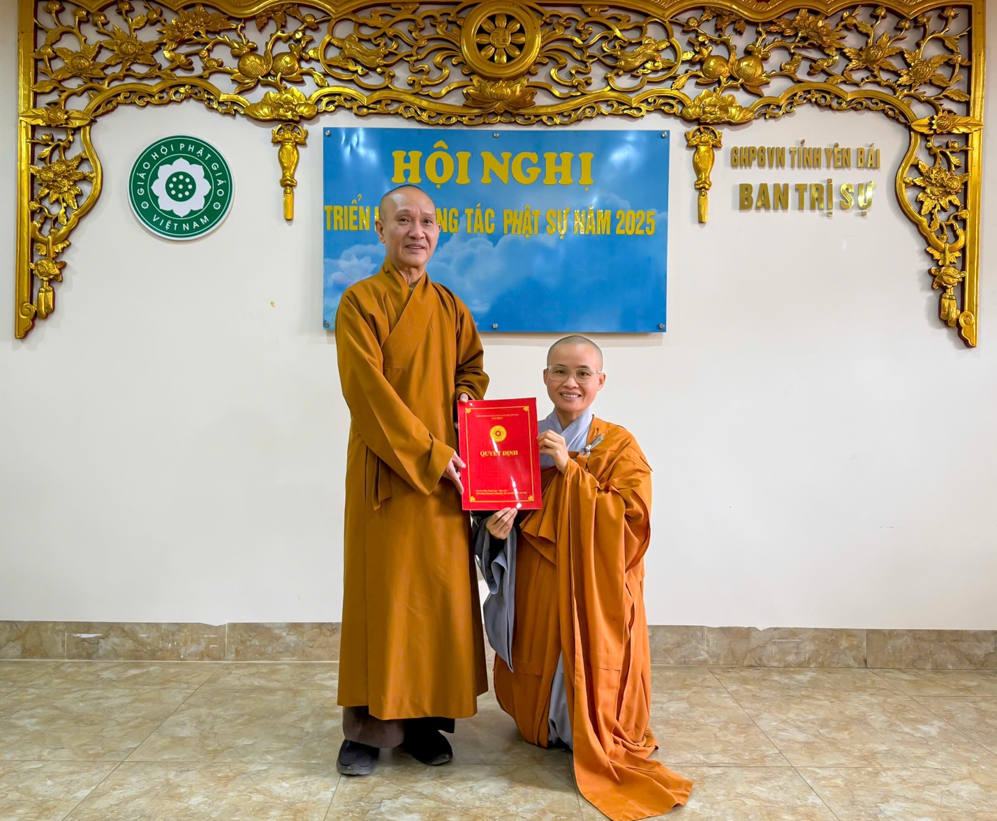 A person and person in robes holding a red certificate AI-generated content may be incorrect.