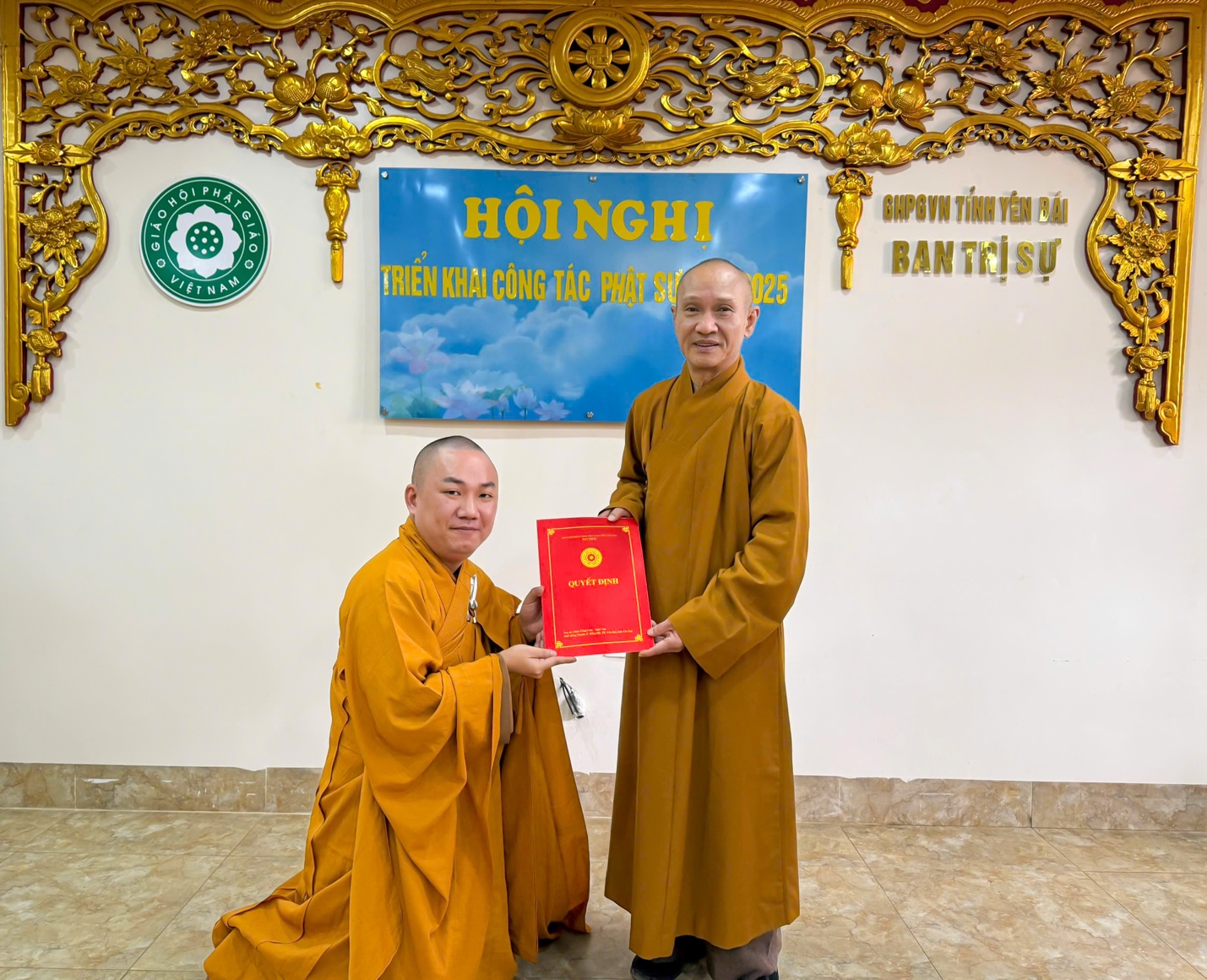 Two men in robes holding a red book AI-generated content may be incorrect.